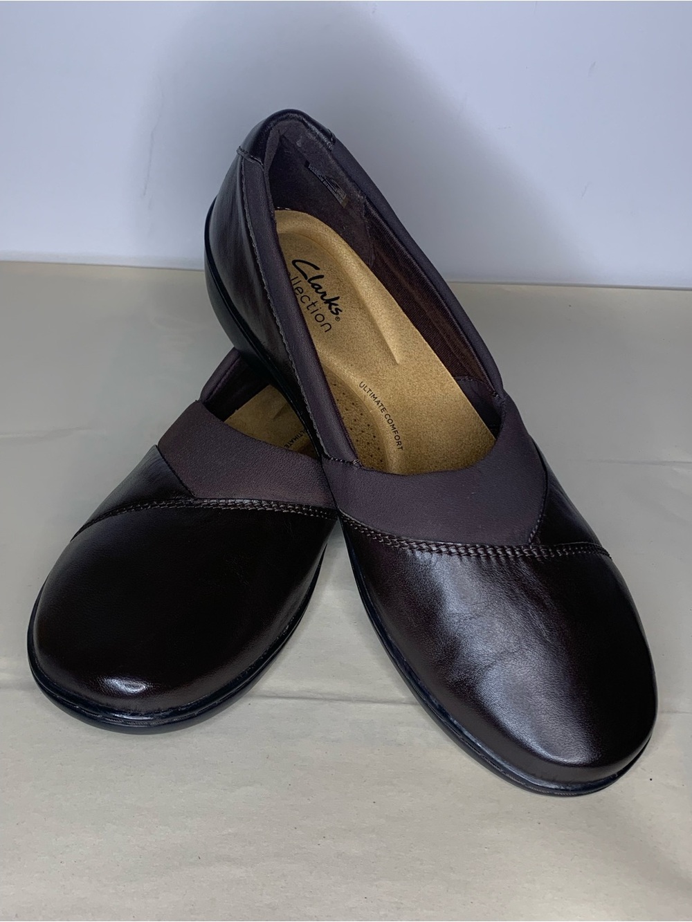 Clark’s Cora Charm slip on flat, dark brown, size 11 wide. New without box.